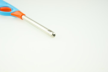 Blue and orange plastic lighter put on top left