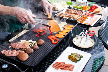 Flames grilling a steak on the BBQ