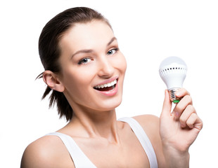 Happy woman with a LED lightbulb