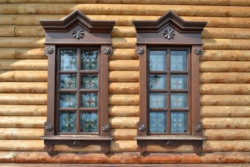 Fototapeta na wymiar The window in the wooden house