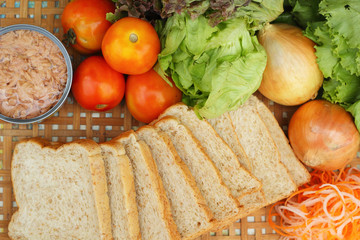 making tuna sandwich with fresh vegetables