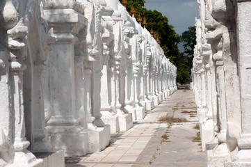 Row of white pagodas in Kuthodaw temple, Myanmar.