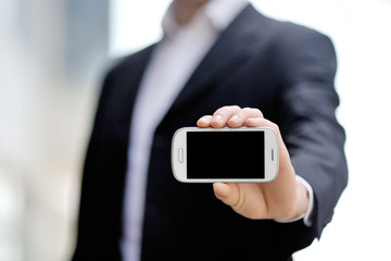 businessman holding mobile smart phone in hand