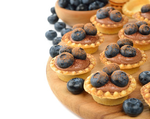 Tartlets with chocolate cream and blueberries