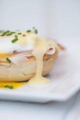 Eggs Benedict toasted English muffins ham poached eggs and holla