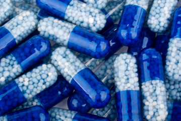 Blue capsules (pills) background
