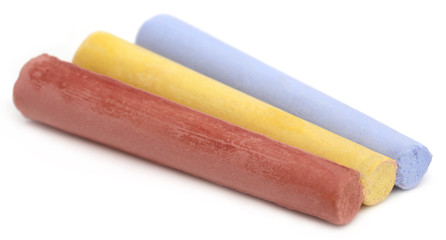 Chalks over white background