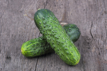 Cucumbers on old wood background