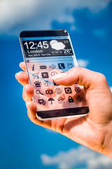 Smartphone with transparent screen in human hands.