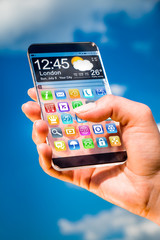 Smartphone with transparent screen in human hands.