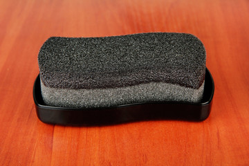 Shoe shine sponge, on wooden background