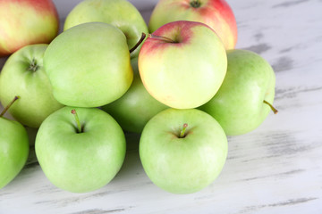 Juicy apples on wooden table