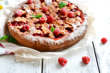 Tasty cake with berries on table close-up