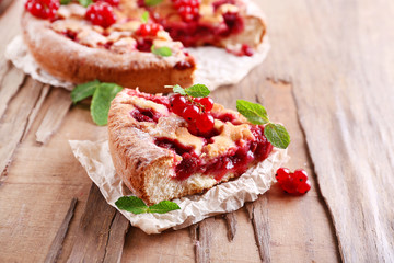 Tasty cake with berries on table close-up