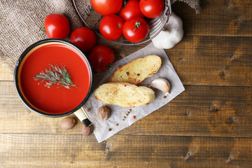Homemade tomato juice in color mug, toasts and fresh tomatoes