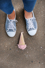 Ice cream fell on asphalt top view