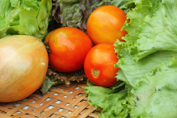 Vegetables salad and tomato in the basket