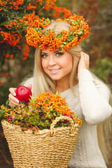 Girl in Orange wreath with Red Apple in hand