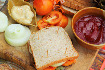 making tuna sandwich with fresh vegetables