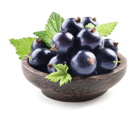 Black currant in wooden plate