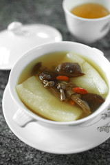 close up chinese vegetarian soup in white cup