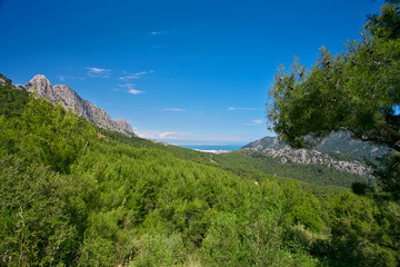 Fototapeta na wymiar Mountains, blue sky and Antalya port