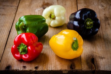 Red, green, black, white and yellow bell peppers
