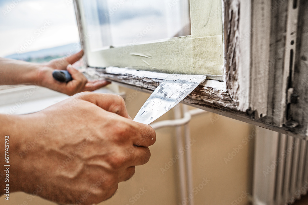 Wall mural Repairing a window frame