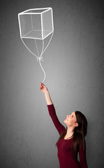 Woman holding a cube balloon