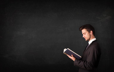 Young man reading a book