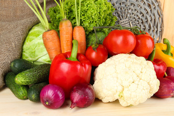 Fresh vegetables on wooden table close up