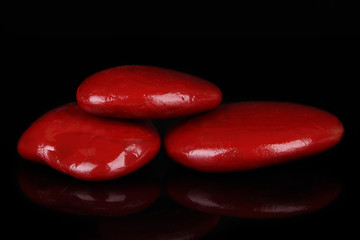 Colorful pebbles, isolated on black