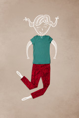 Placed clothes in action with woman drawing