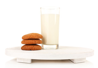 Milk and cookies on wooden tray isolated on white