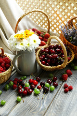 Still life with berries and flowers
