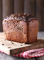 Fresh bread on wooden table, close up