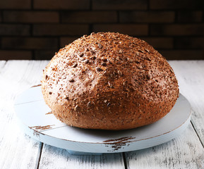 Fresh bread on wooden table, close up