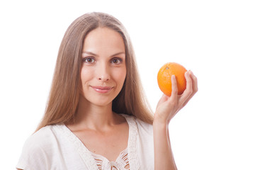 young woman holding a orange