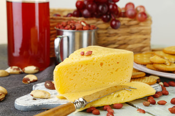 Wine, cheese and crackers on wooden table close-up
