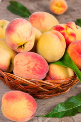 Ripe peaches in a wicker basket