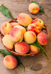 Ripe peaches in a wicker basket