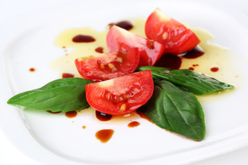 Balsamic vinegar,  tomato and basil isolated on white