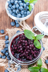 Glass with canned Blueberries