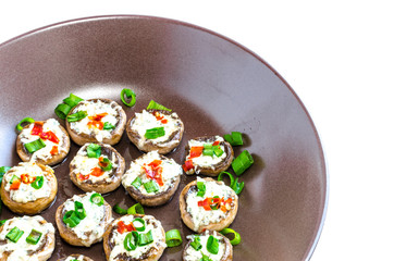Baked muhrooms with blue cheese, red pepper and spring onion