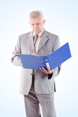 Senior Businessman looking at documents