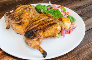 Chicken under a brick with panzanella salad