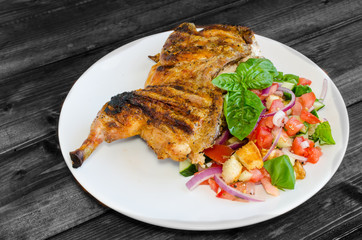 Chicken under a brick with panzanella salad