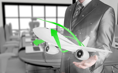 Businessman with airplane over his hand