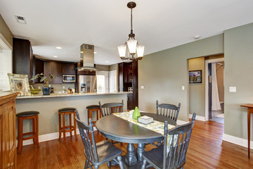 Dark brown kitchen room with dining area