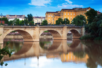 Obraz premium ancient stone bridge over Ebro in evening. Logrono